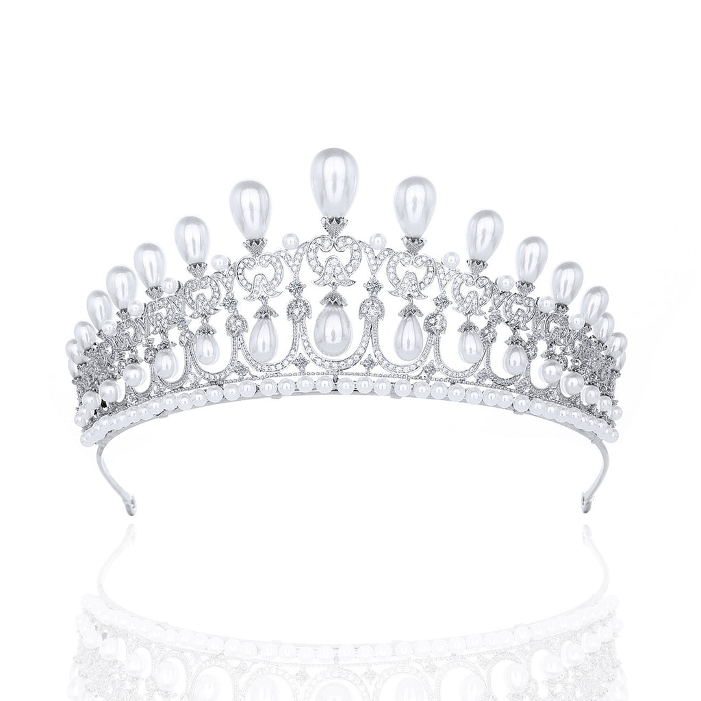 Silver tiara with pearls on a white background