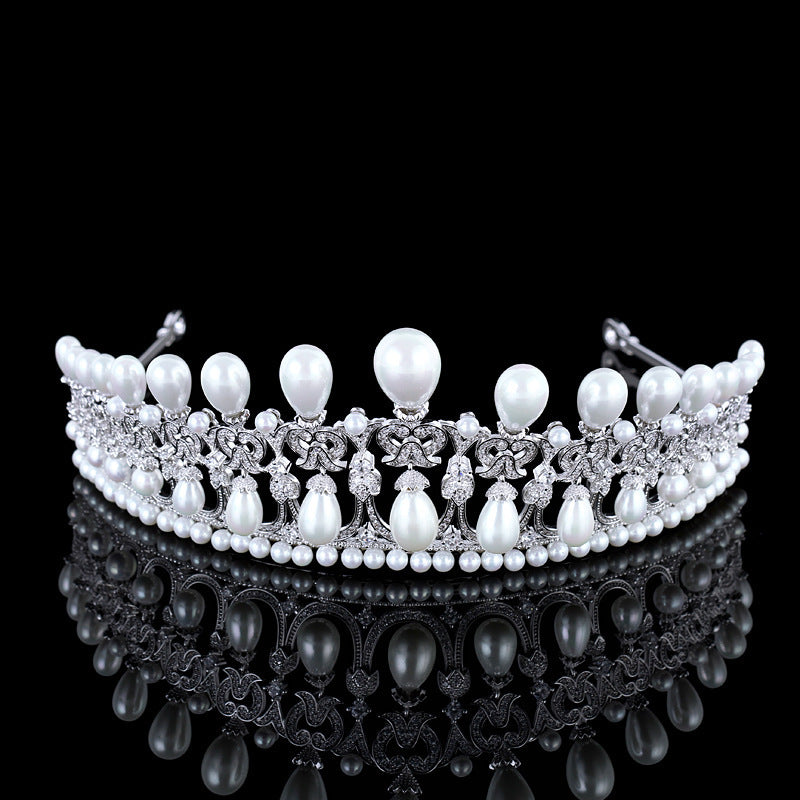 Pearl tiara with intricate design on a black background