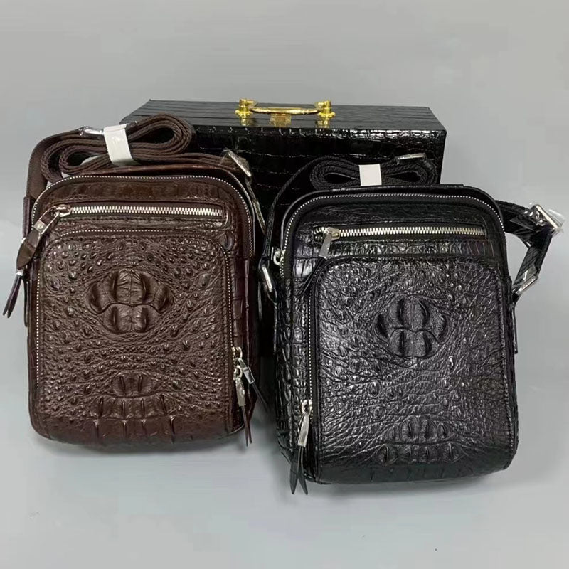 Two leather bags, one brown and one black, with a visible brand logo on a gray background.