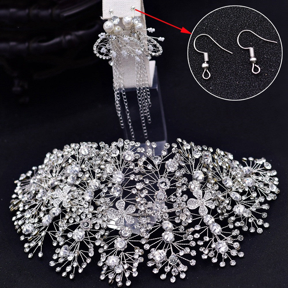 Silver hairpiece with intricate design on a black background, accompanied by a close-up of silver earrings.