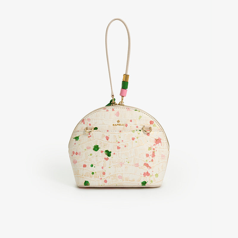 Small floral pouch with a strap on a white background
