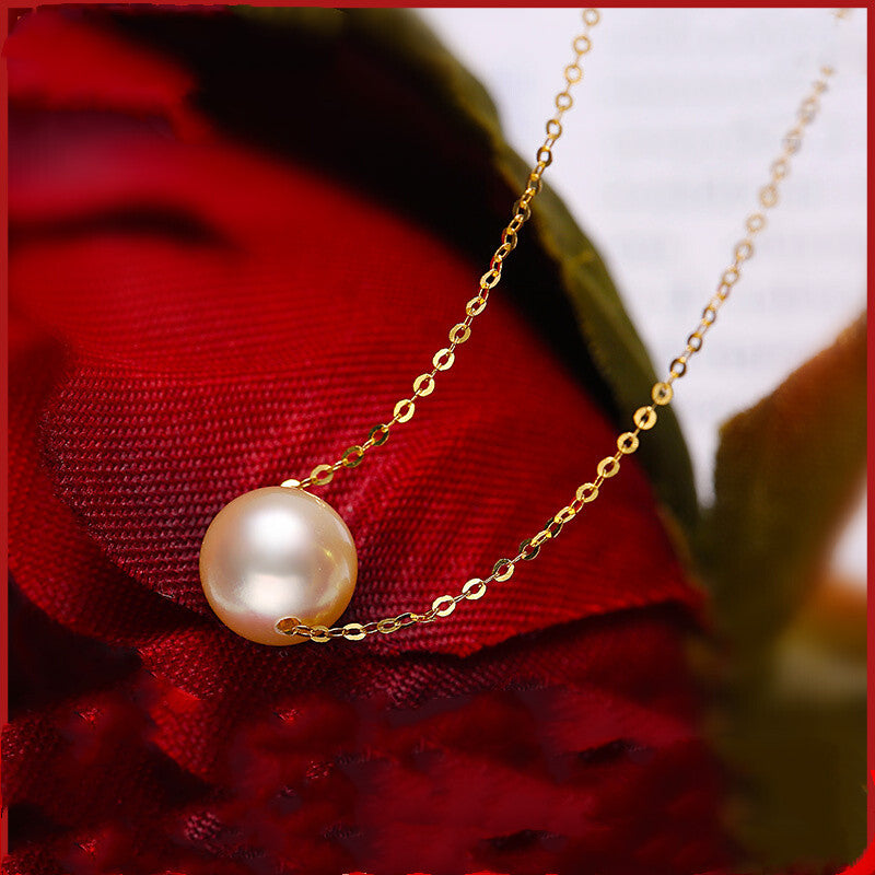 Pearl necklace on a red fabric background