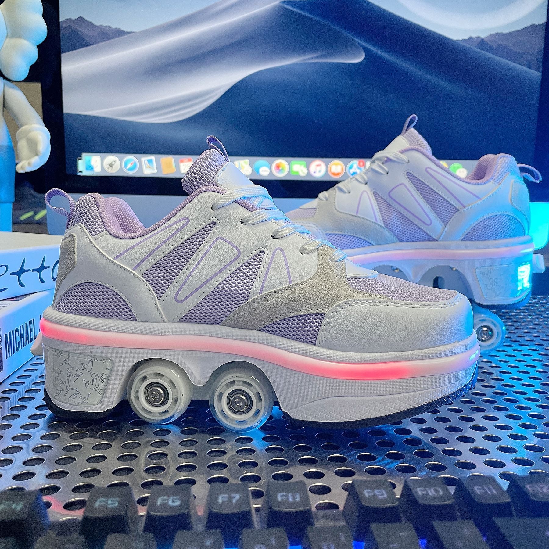White sneakers with glowing sole on a computer keyboard