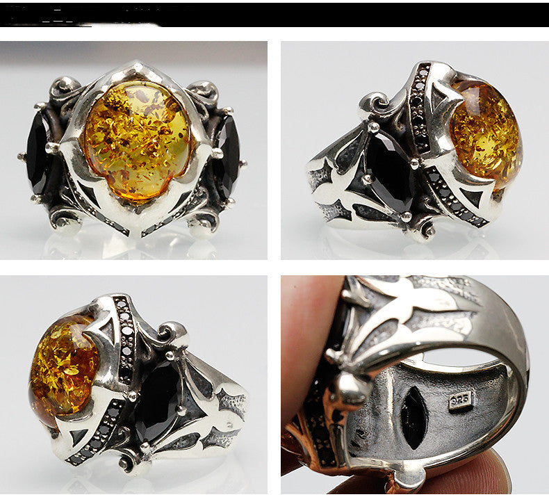 Silver ring with amber stone and black gemstone, shown from multiple angles.