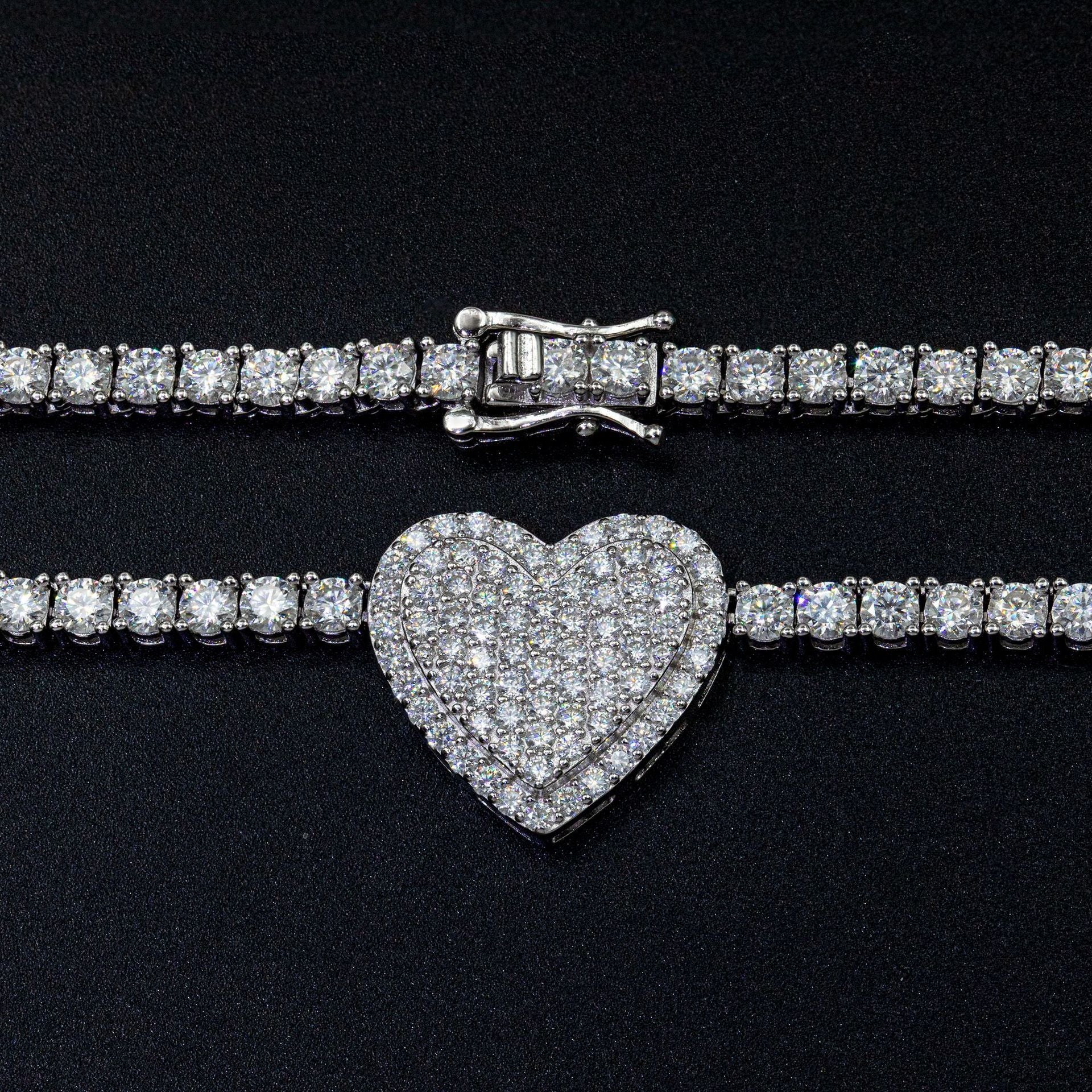 Diamond bracelet with a heart-shaped clasp on a black background