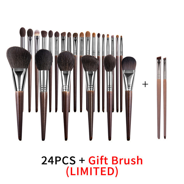 Set of 24 makeup brushes with a gift brush on a white background