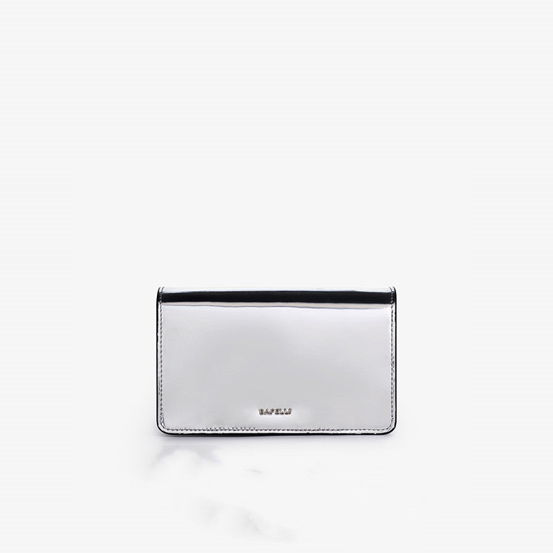 Silver wallet with black accents on a white background