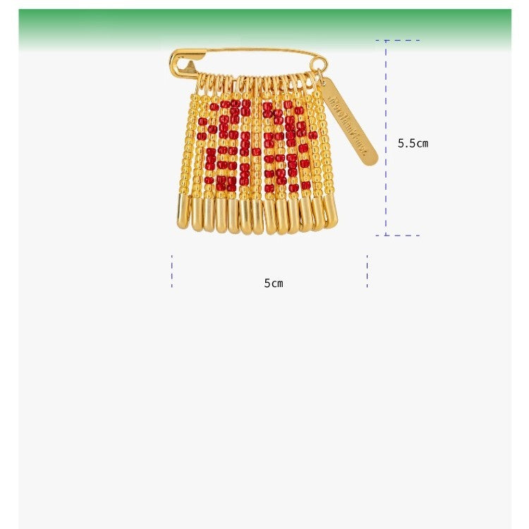 Gold and red decorative item with measurements on a white background