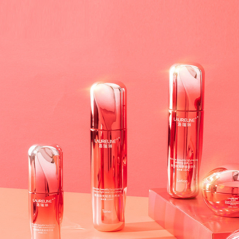 Set of red skincare bottles with 'LURELINE' branding on a pink background