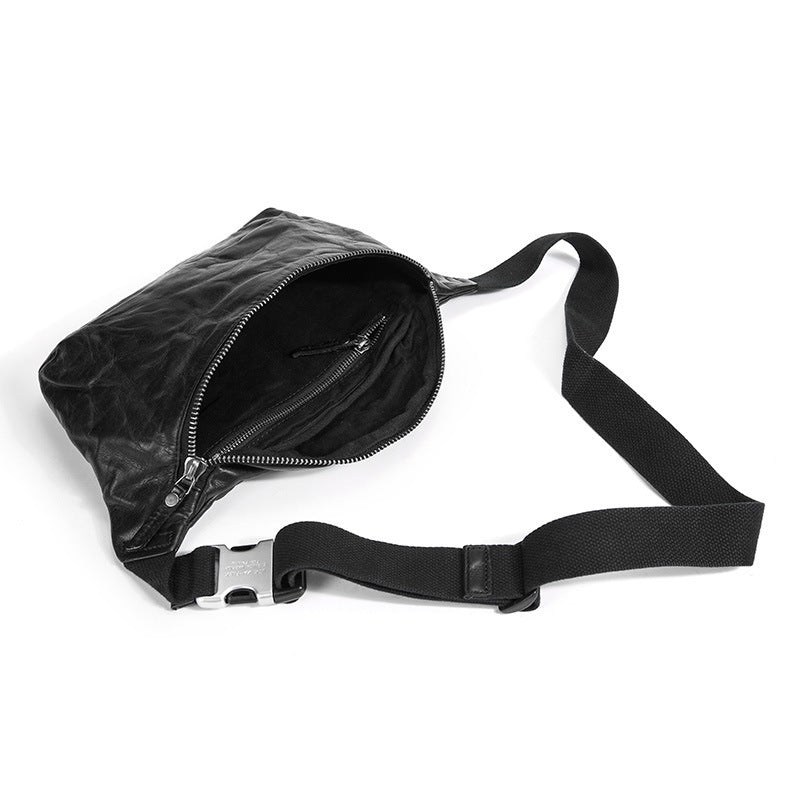 Black waist bag with a strap on a white background
