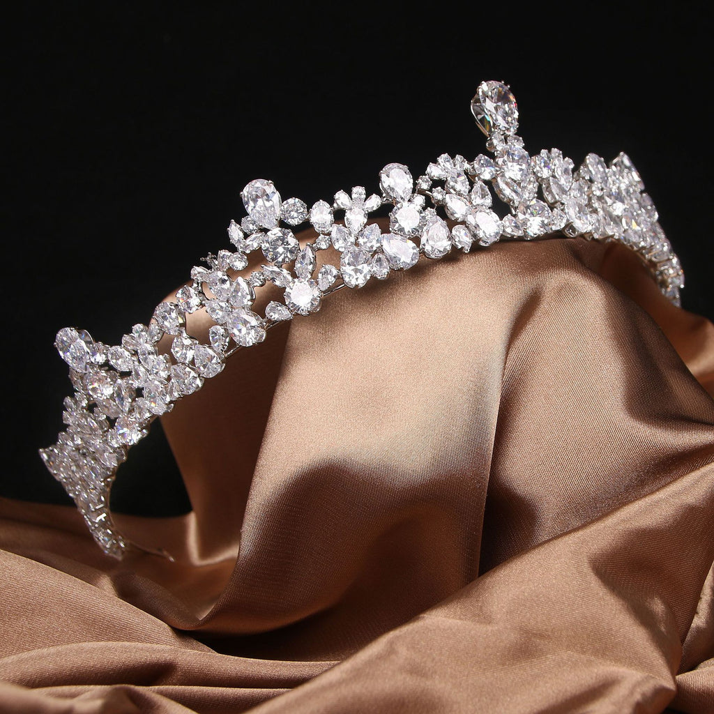 Elegant diamond tiara on a brown fabric background