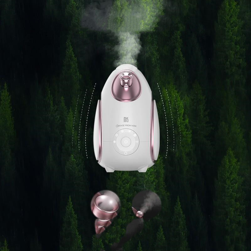 White and pink facial steamer with steam rising against a dark green forest background