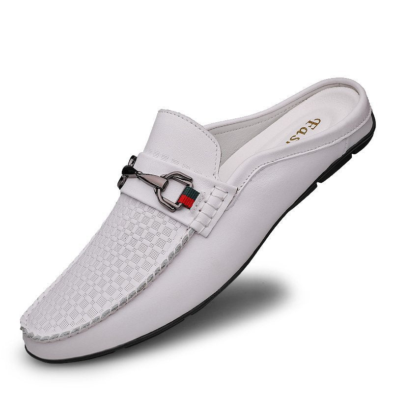 White slip-on shoe with a decorative buckle on a white background