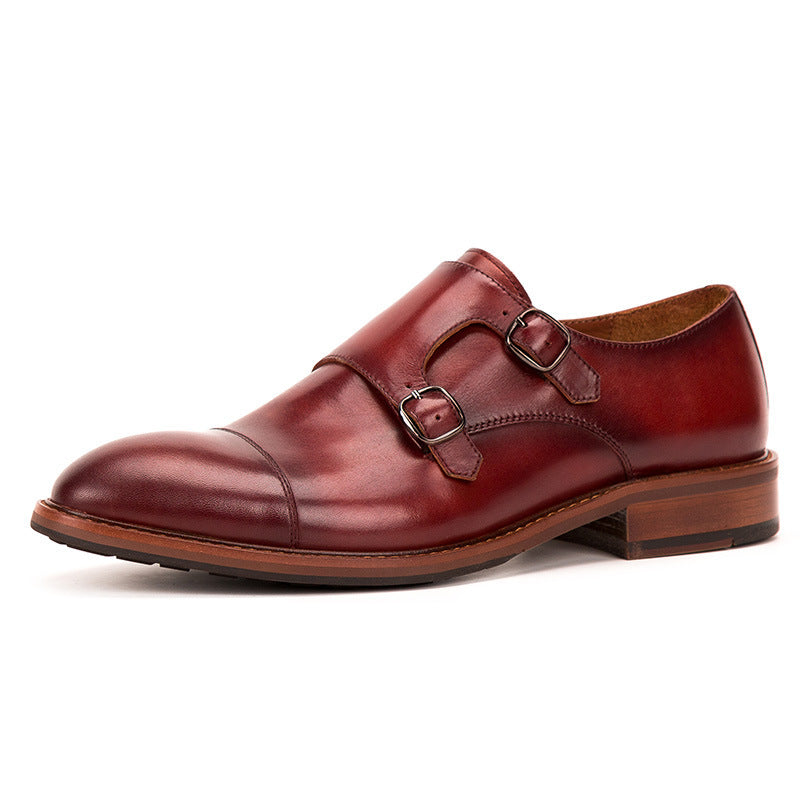 Brown leather dress shoe with a single buckle on a white background