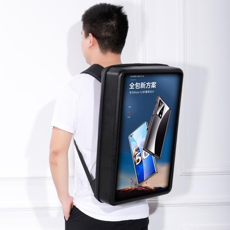 Person wearing a black backpack with a display of a smartphone on a white background
