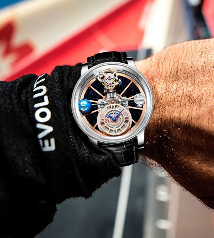 Close-up of a person wearing a detailed wristwatch with a blurred background