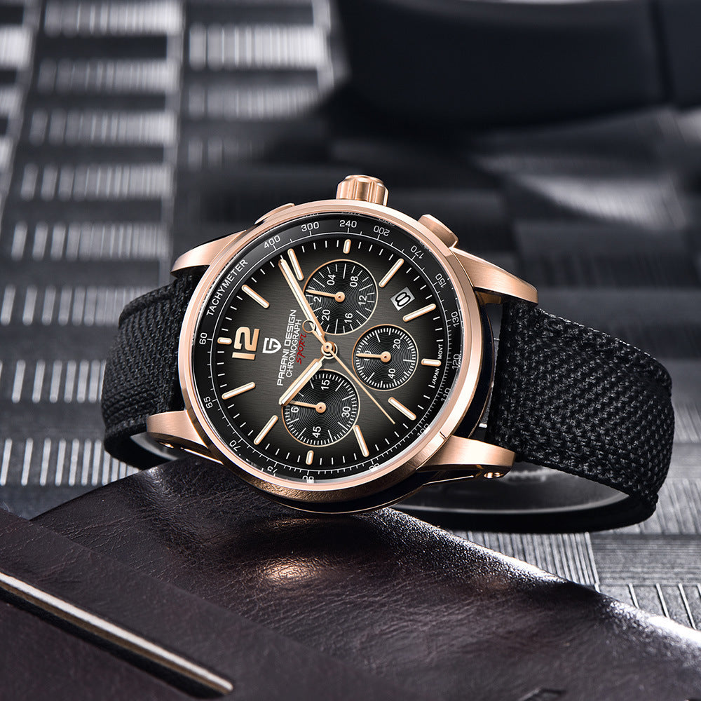 Luxury watch with black strap and rose gold case on a textured surface