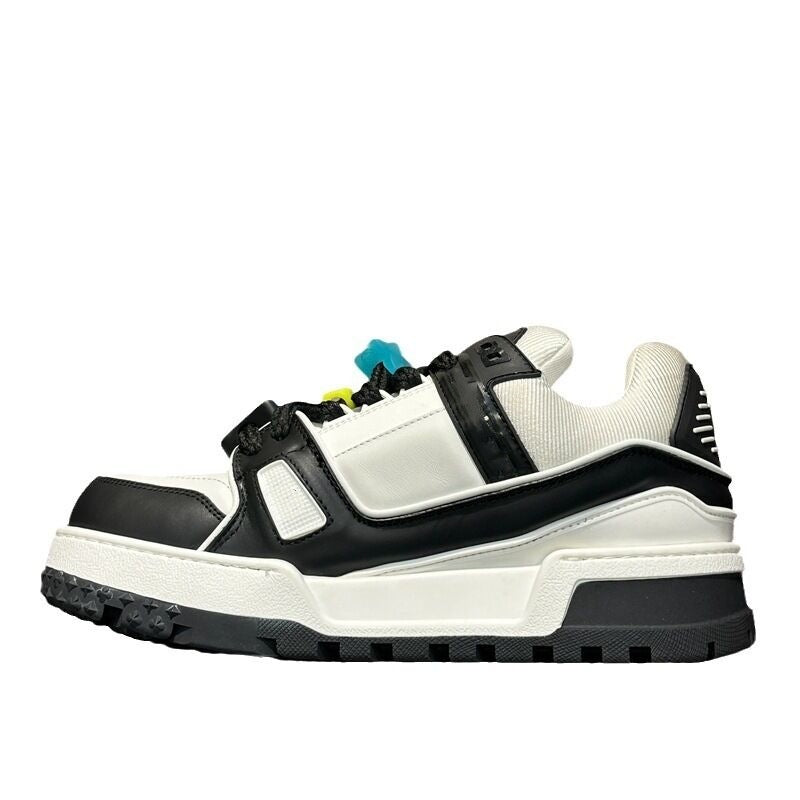 Black and white sneaker with colorful accents on a white background