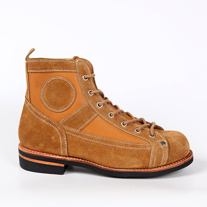 Brown leather boot with black sole on a white background