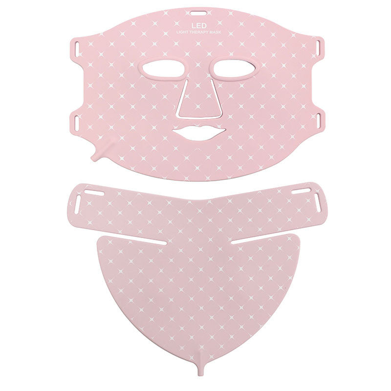 Pink face mask with white patterns on a white background