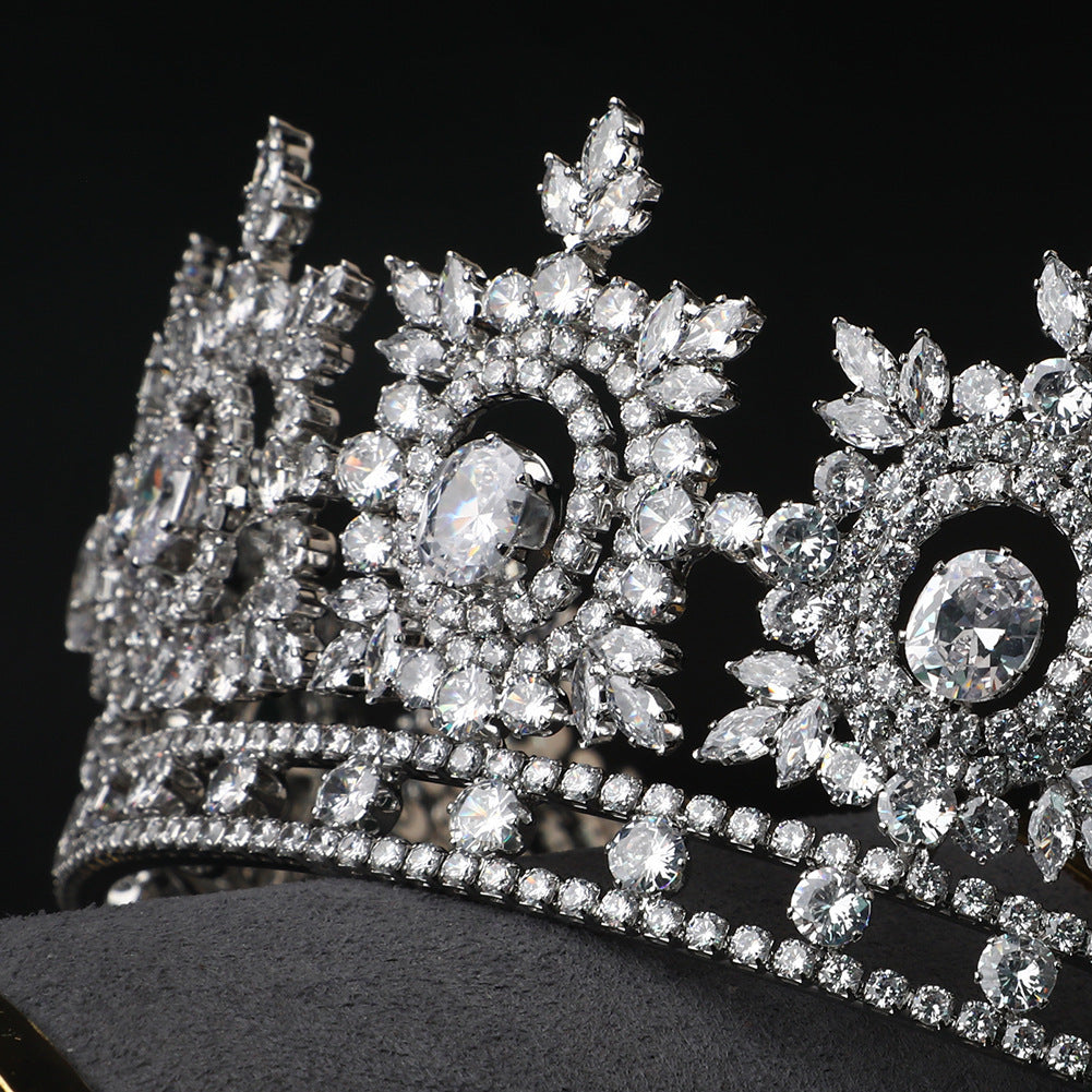 Close-up of a sparkling diamond tiara on a black background