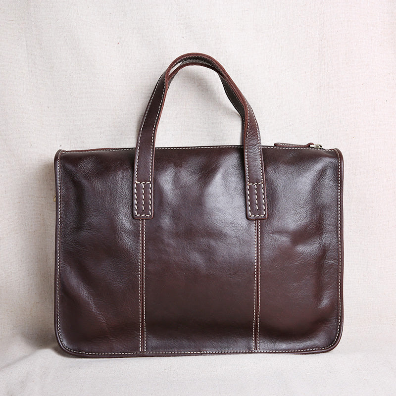 Brown leather briefcase on a light gray background