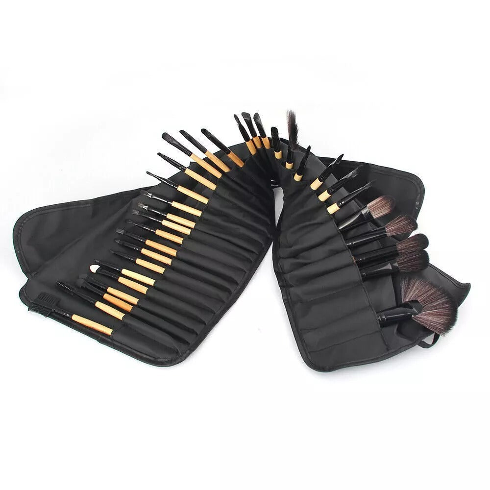 Set of makeup brushes in a black case on a white background