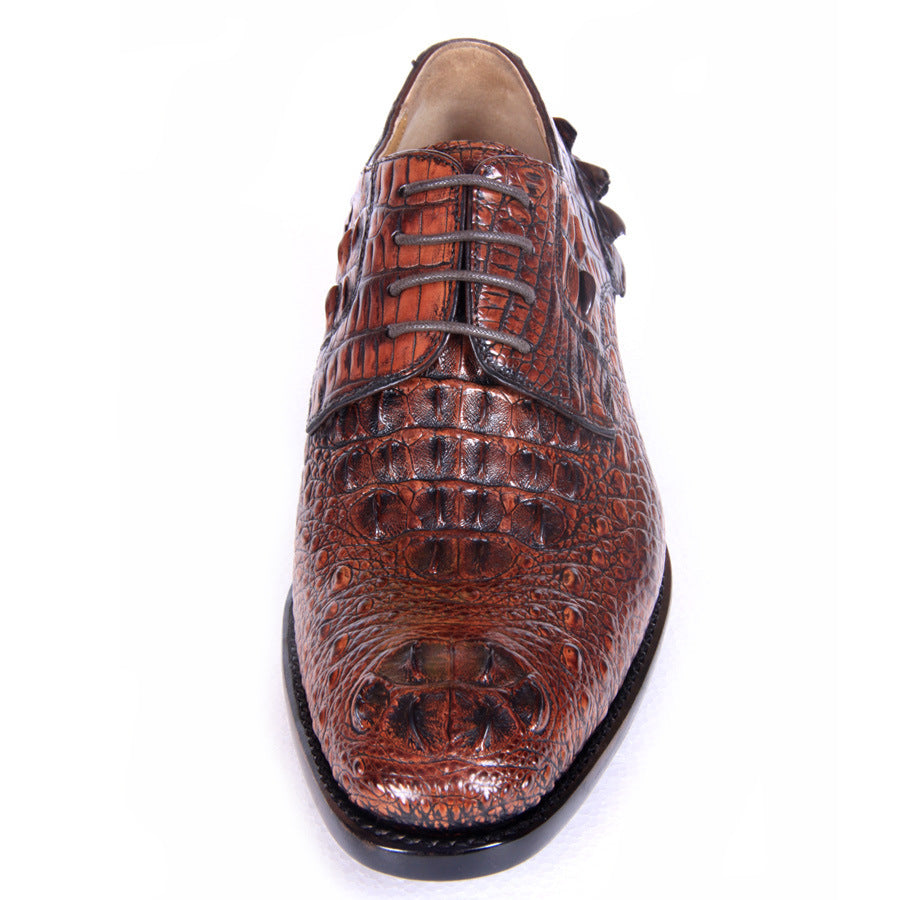 Brown crocodile-patterned shoe on a white background