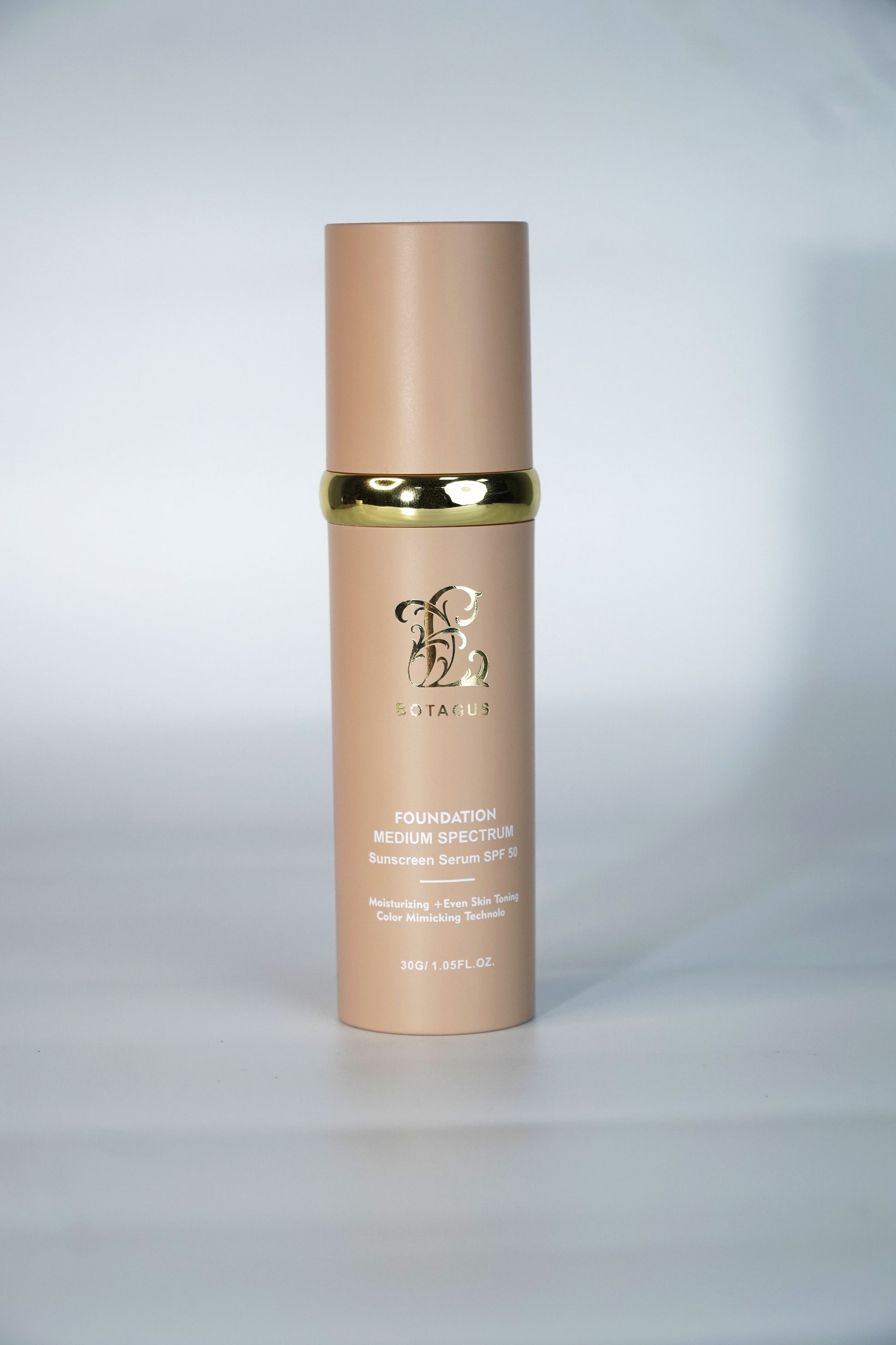 Skincare serum bottle with visible branding on a blue background