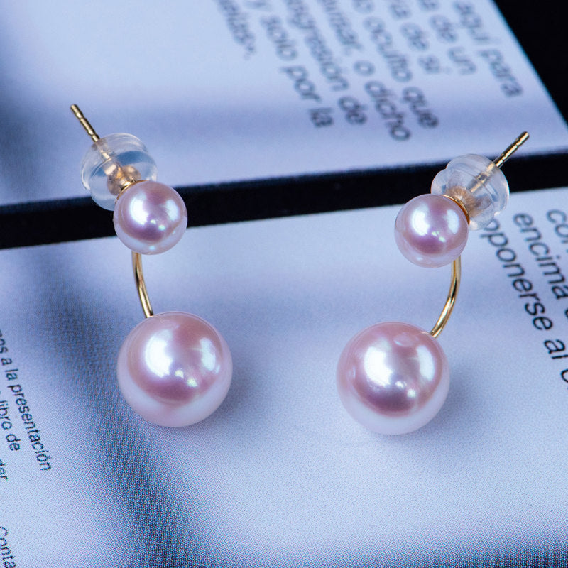 Pearl earrings on a magazine page