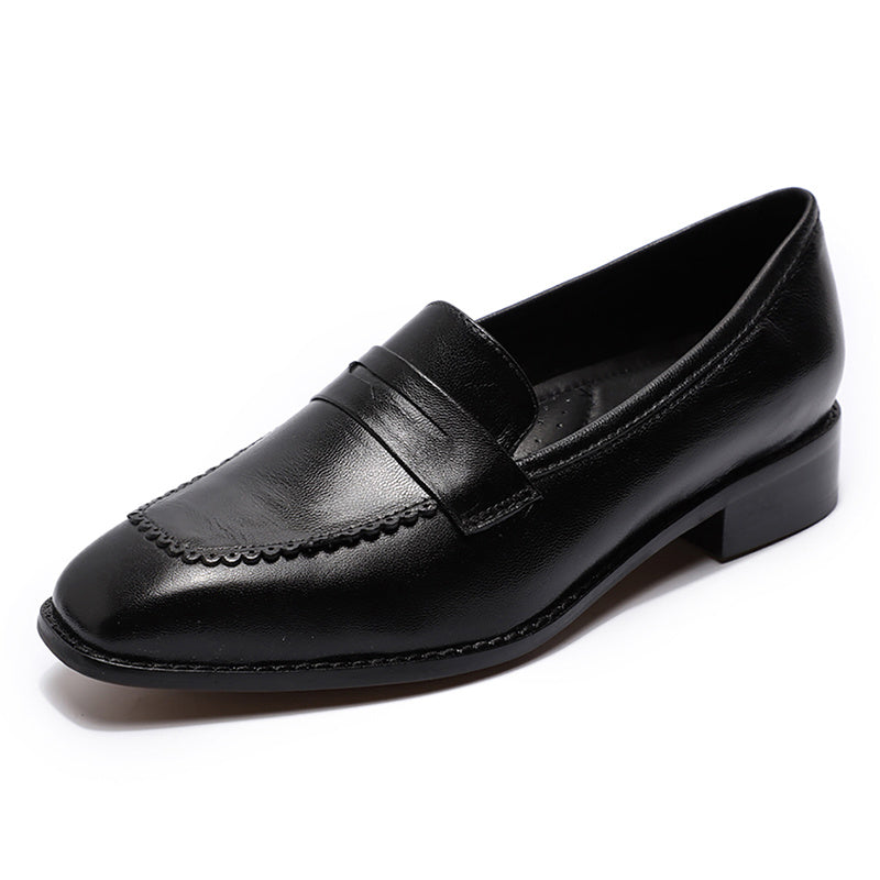 Black leather loafer shoe on a white background