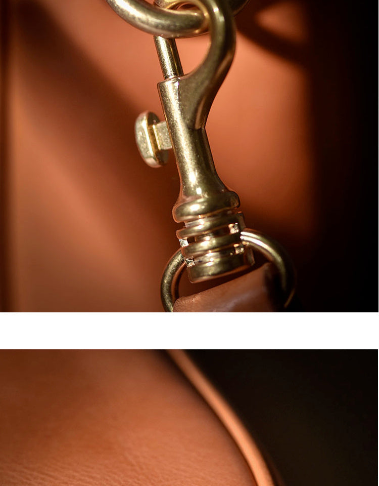 Close-up of a gold horse bit on a leather background