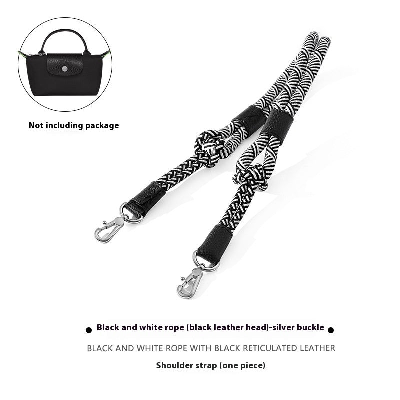 Black and white rope shoulder strap with silver buckle on a white background