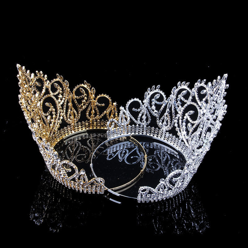 Gold and silver tiaras on a black background