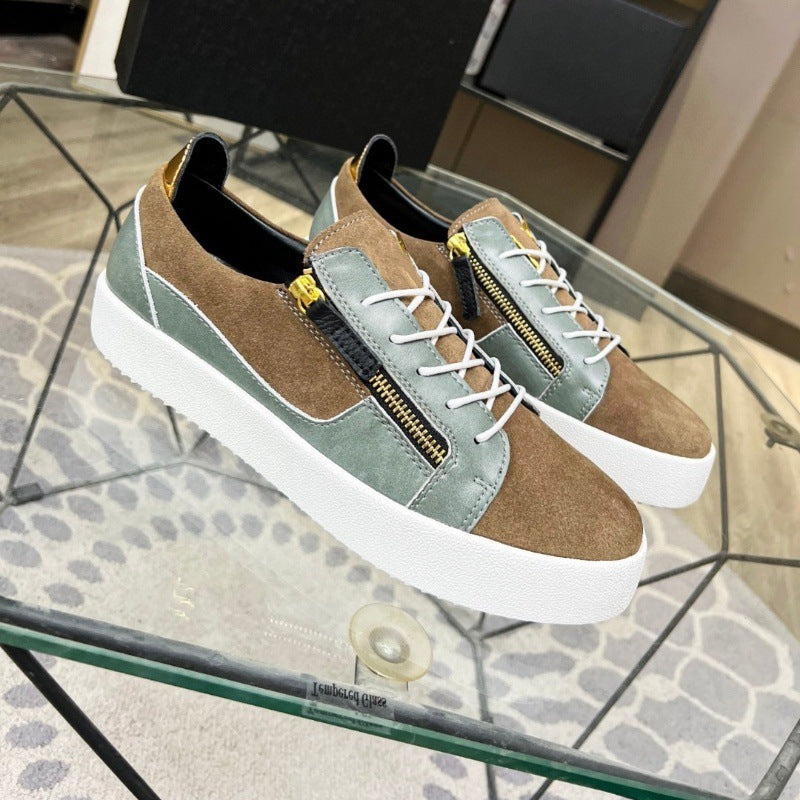 Pair of brown and green sneakers on a glass table