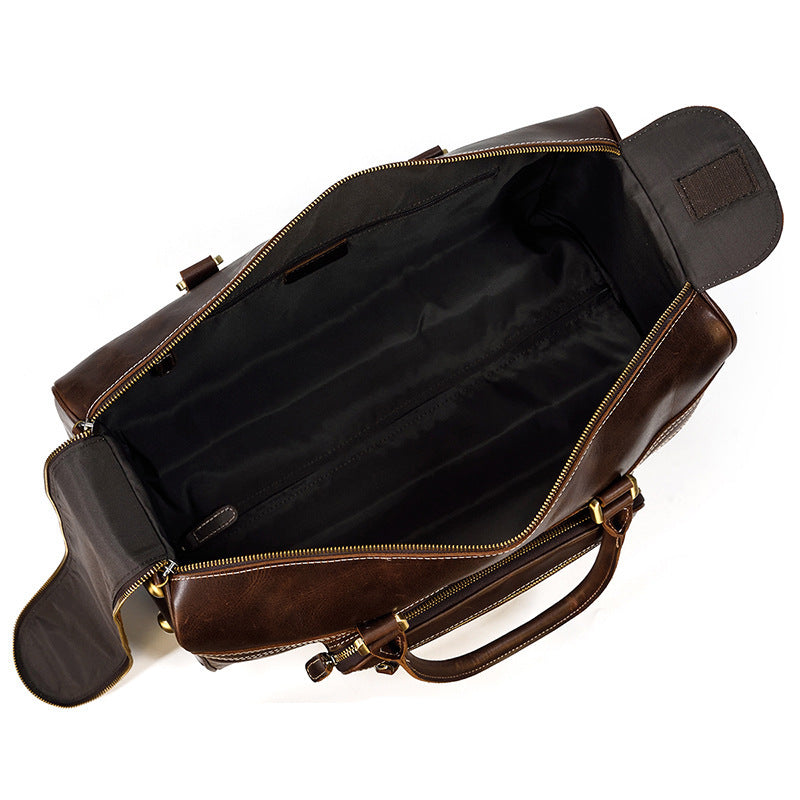 Brown leather bag with open compartment on a white background