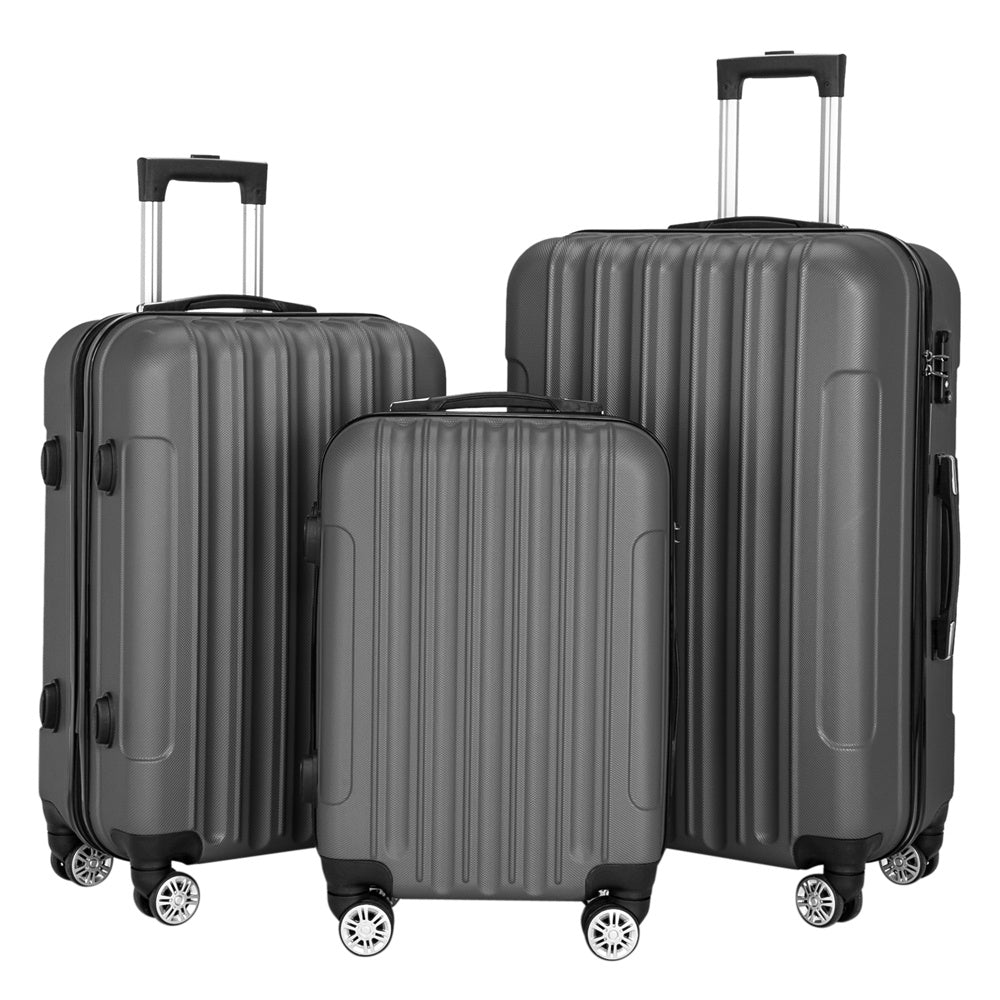 Three gray suitcases of different sizes on a white background