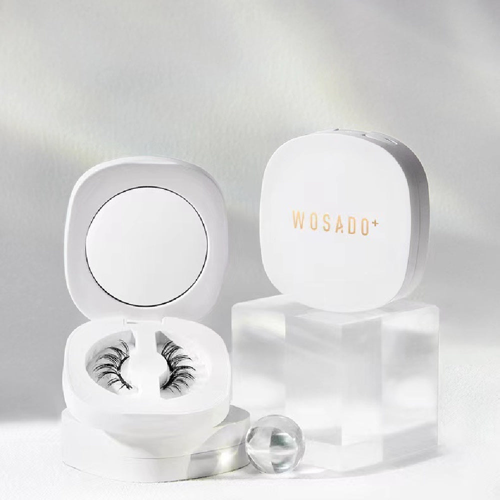 White container with false eyelashes and 'WOSADO' branding on a light gray background