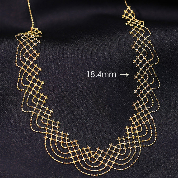 Gold necklace on a black background with measurement label
