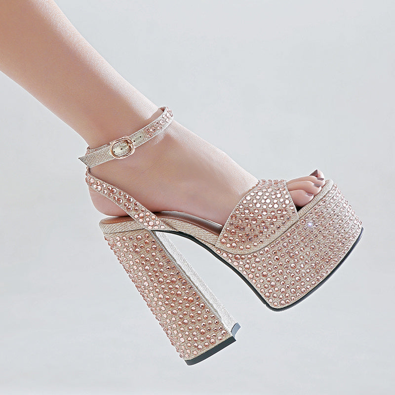 Sparkly high-heeled sandal on a light gray background