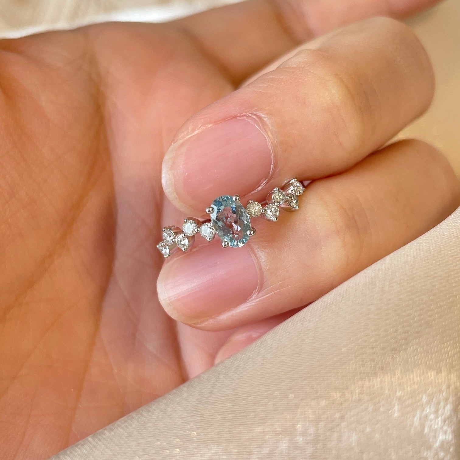 Ring with a blue gemstone on a hand