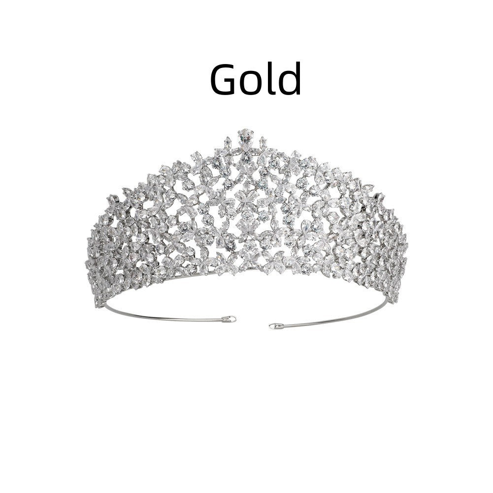 Gold tiara on a white background with 'Gold' text above it.