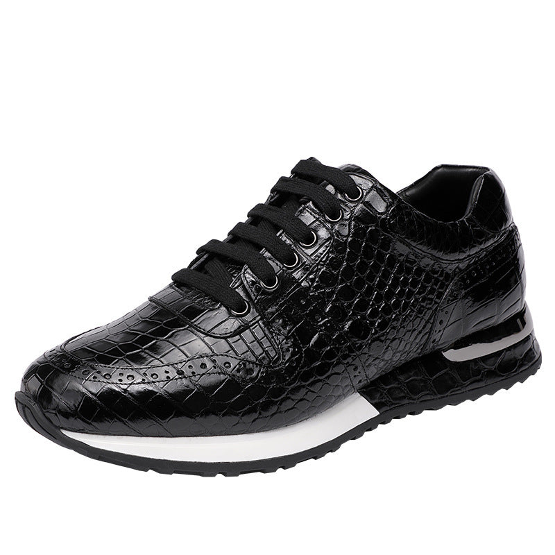 Black crocodile-patterned sneaker on a white background