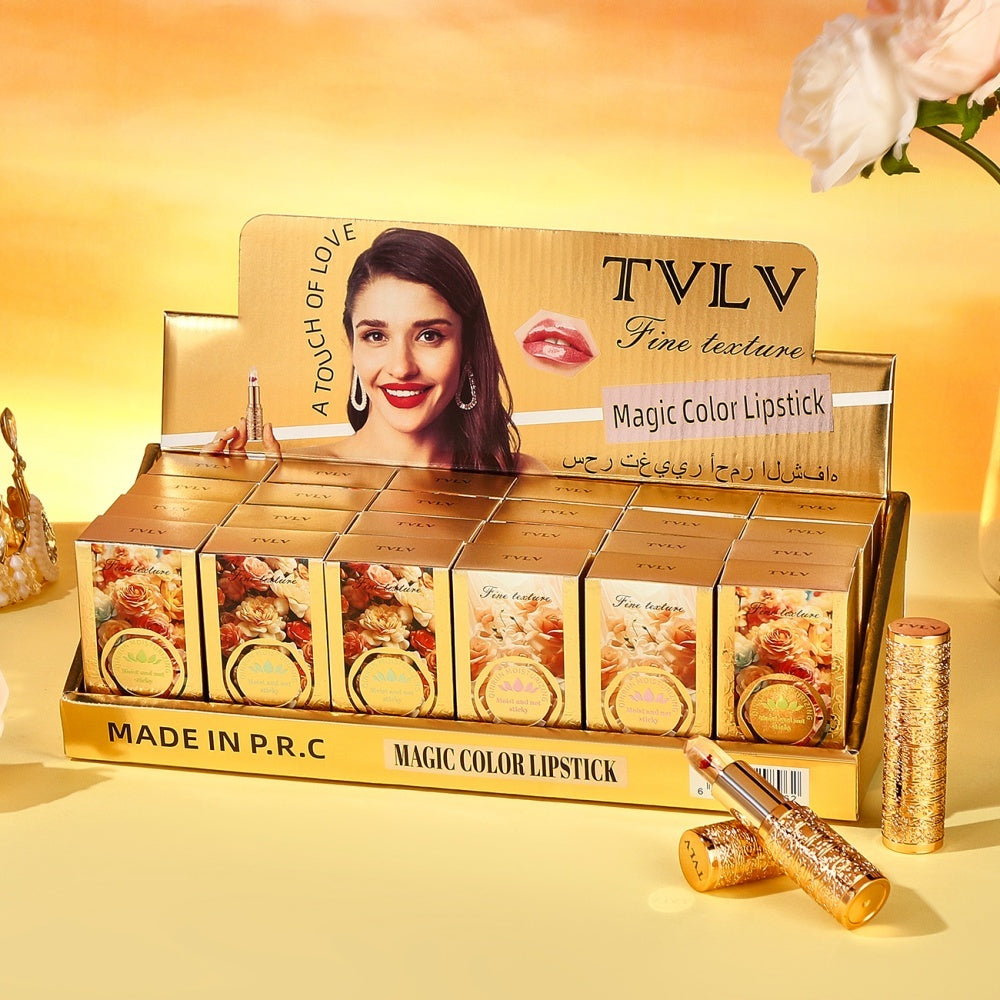 TVLV Magic Color Lipstick display with packaging and lipsticks on a yellow background
