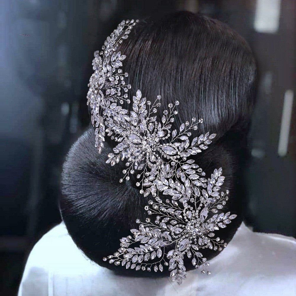 Close-up of a decorative hairpiece with intricate designs on a blurred background