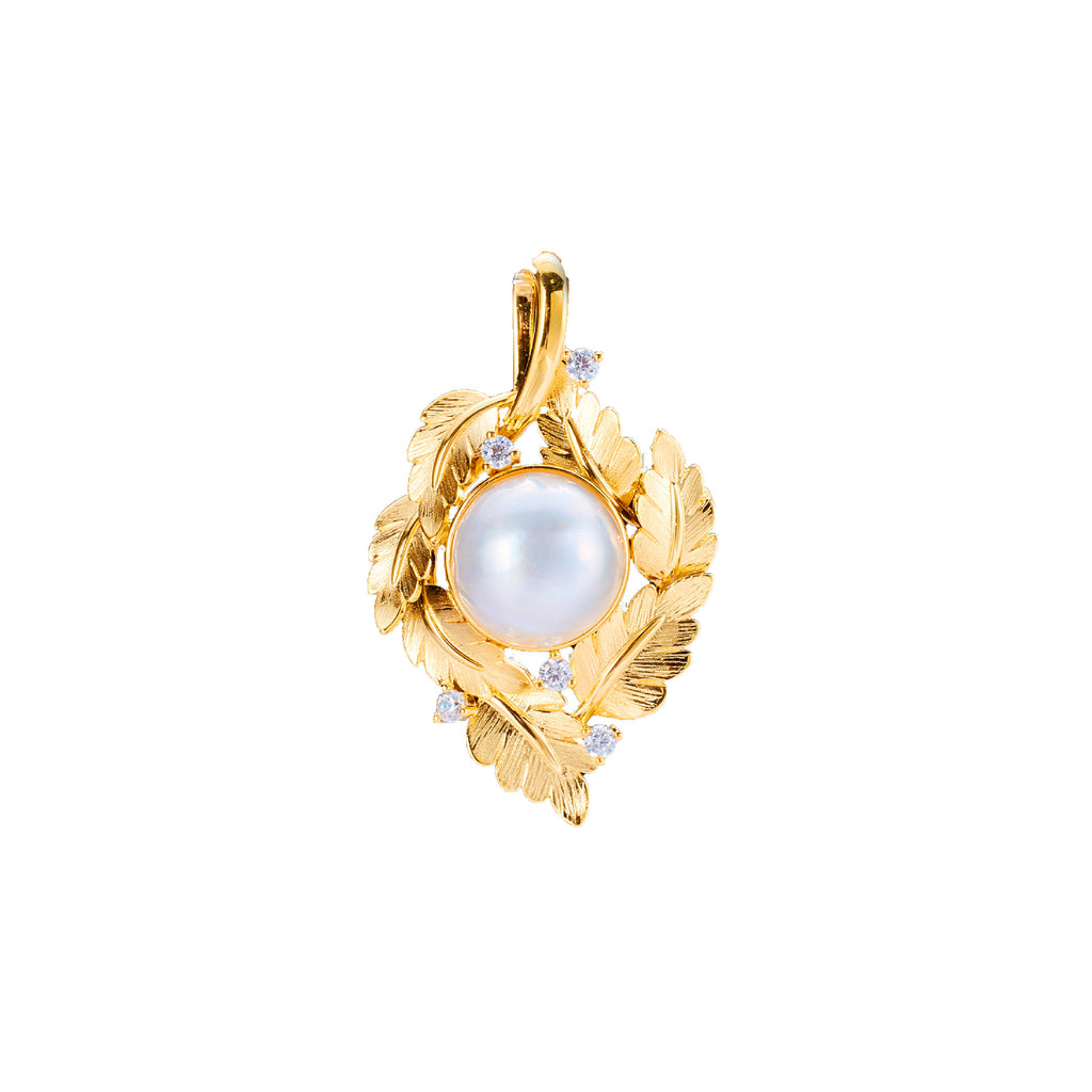Gold pendant with a pearl on a white background
