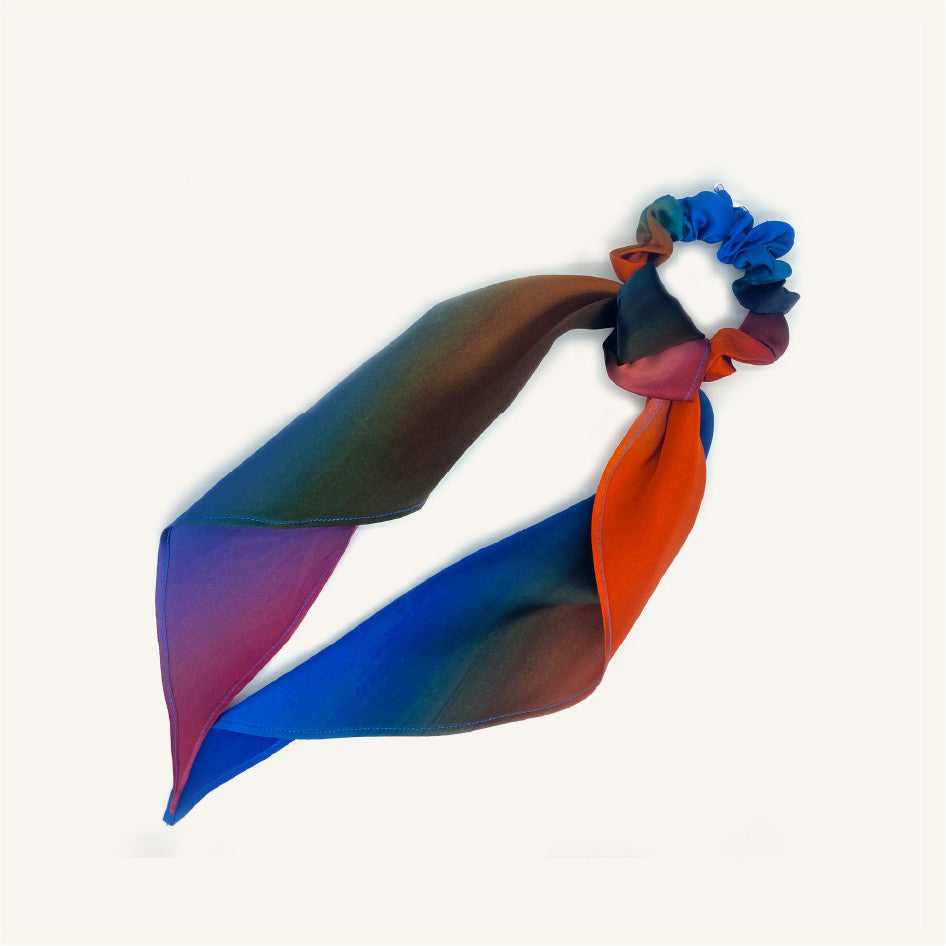 Colorful scarf and scrunchies on a white background