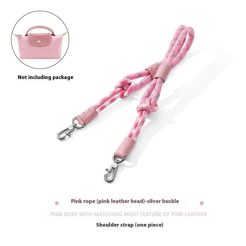 Pink shoulder strap with matching mesh texture and silver buckle on a white background