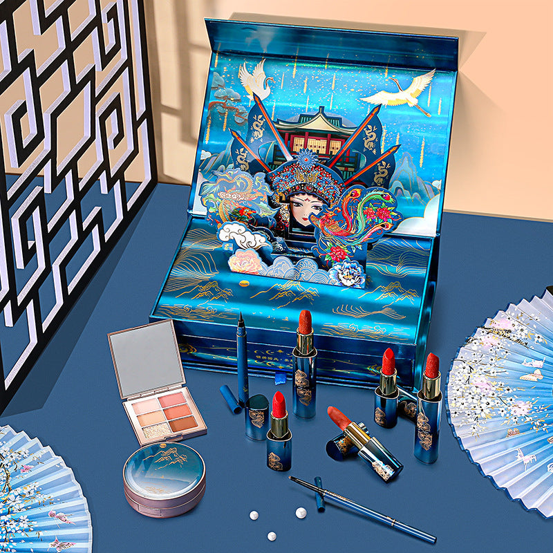 Makeup set with decorative packaging on a blue surface