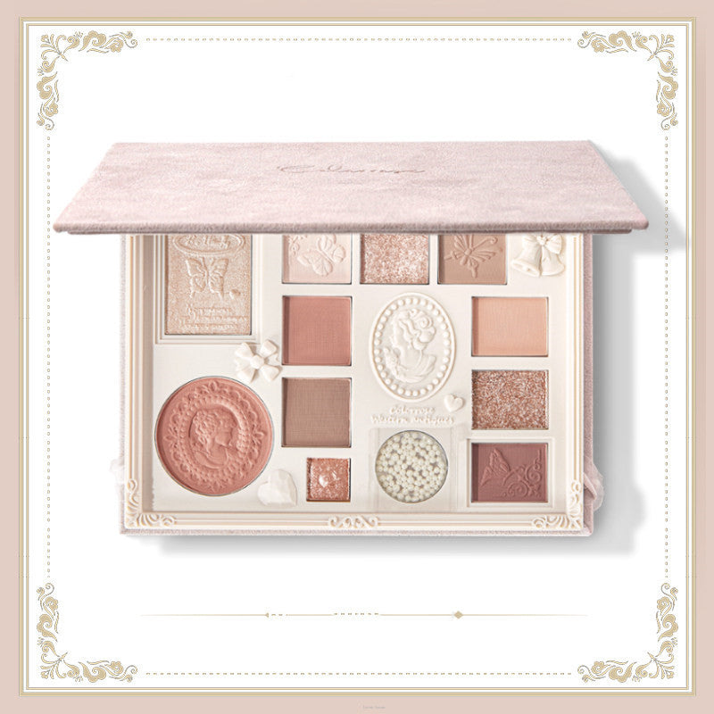 Makeup palette with decorative design on a light background